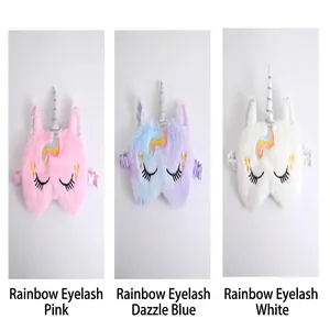 Plush unicorn sleep eye masks in pink blue and white with rainbow eyelashes detail