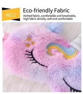 Macro detail of plush unicorn sleep mask showing soft pink and purple gradient fur texture