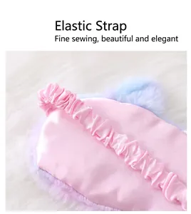 Detailed close-up showing the durable elastic strap on a soft plush unicorn sleep mask