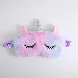 Soft plush unicorn sleep mask with gradient rainbow colors and closed eyes embroidery.