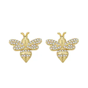 Close-up of gold-plated bee stud earrings with micro-pave cubic zirconia stones