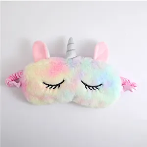 Soft plush unicorn sleep mask with colorful rainbow gradient and shiny silver horn