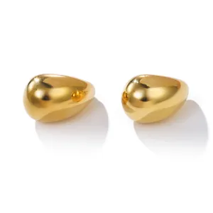 Detailed close-up of French minimalist gold hollow drop earrings with smooth finish.