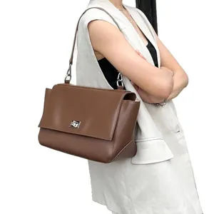 Premium brown genuine leather messenger bag for women with large capacity and flap lock