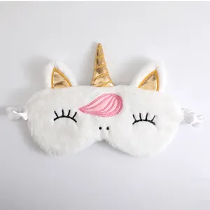Soft white plush unicorn sleeping mask with golden horn and cute embroidered eyelashes