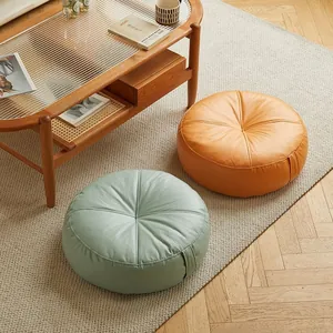 Comfortable round Japanese leather floor cushions in orange and green for tatami