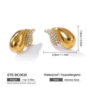 Detailed view of gold teardrop earrings with rhinestones and precise measurements.