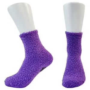 Detailed view of thick purple coral fleece floor socks featuring anti-slip sole dots