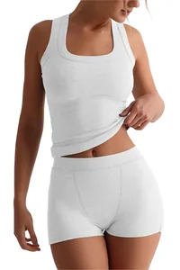 Close-up of women's white ribbed tank top and high-waisted shorts two-piece set