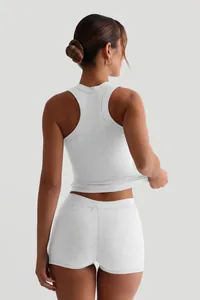 Detailed back view of women's white rib-knit slim fit tank top and high waist shorts