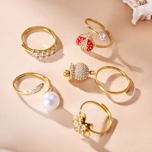 Elegant gold-plated jewelry ring set featuring ladybug, flower and zircon designs