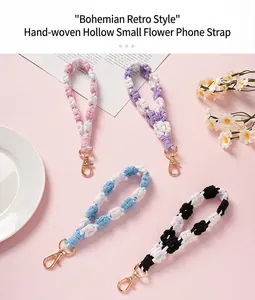 Hand-woven bohemian macrame phone lanyard with floral pattern and gold metal clasp