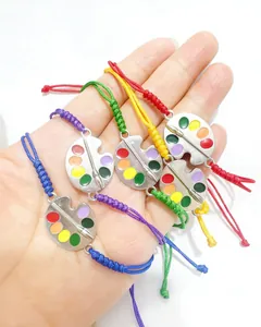 Hand-woven braided rope bracelets with colorful artist palette metal charms set.