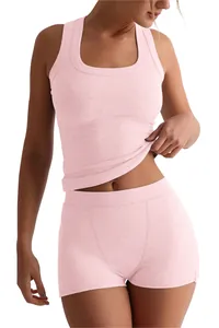 Detail view of pink ribbed sleeveless tank top and matching high-waisted lounge shorts set