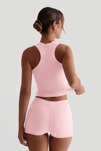 Macro view showing back detail and ribbed fabric texture of pink loungewear set.
