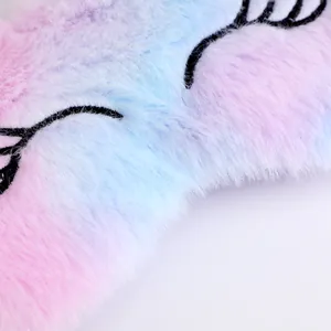 Plush rainbow eye mask with soft fur and cute embroidered eyelashes for sleep.