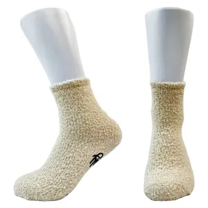 Detailed view of beige thick coral fleece floor socks with wine glass anti-slip grips