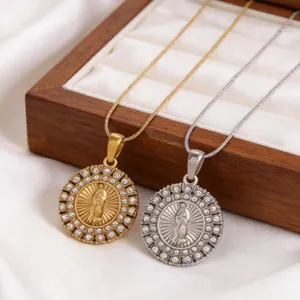 Exquisite detail view of gold and silver Virgin Mary medallion necklaces on satin