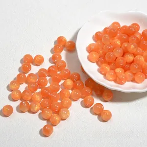 Detail van 10mm oranje glitter acryl hars kralen voor het maken van sieraden