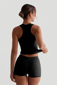 Detail back view of a woman in black ribbed tank top and high waist shorts set