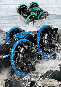 Waterproof amphibious stunt RC car splashing through water on a rocky coast background