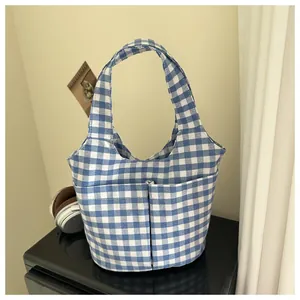 Large blue and white checkered gingham canvas tote bag with front storage pockets