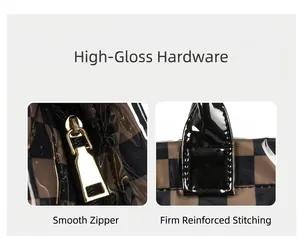 Detail view of high-gloss gold zipper and reinforced stitching on checkerboard tote