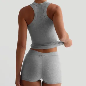Women's grey ribbed racerback tank top and high waist shorts two-piece casual lounge set.