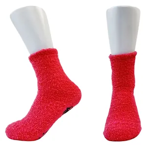 Red thick coral fleece floor socks featuring non-slip silicone grippers on the sole