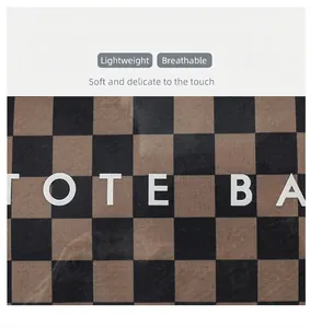Close-up of retro checkerboard pattern on a durable transparent PVC tote bag.