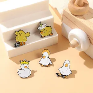 Detailed view of cute duck metal enamel pins with crown, flower, and skateboard