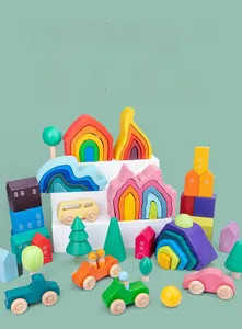Detailed view of colorful wooden rainbow stacking blocks and forest tree toy set.