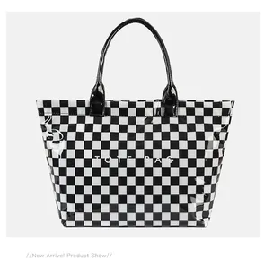 Large capacity checkerboard PVC tote bag with black and white grid pattern and straps