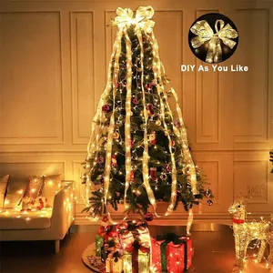 Warm white LED ribbon lights on Christmas tree with DIY gold satin finish decoration