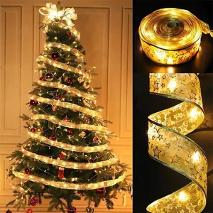 Close-up of warm white LED ribbon lights with bronzed star patterns for Christmas decor