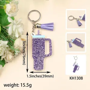 Detail view of purple glitter acrylic tumbler keychain with size and weight specs