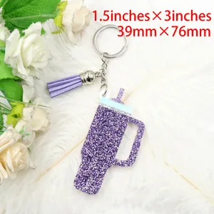 Glitter purple acrylic tumbler shaped keychain with tassel, measuring 1.5x3 inches