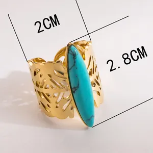 Vintage stainless steel open ring with turquoise stone and hollow leaf patterns