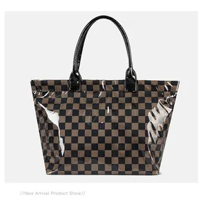 Full view of a stylish glossy checkerboard tote bag with black handles on a white background