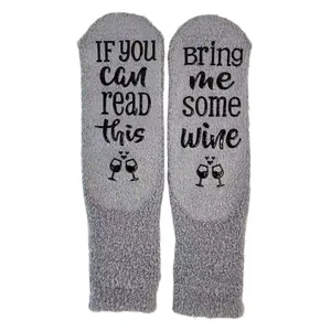 Cozy gray coral fleece floor socks featuring non-slip Bring Me Some Wine lettering