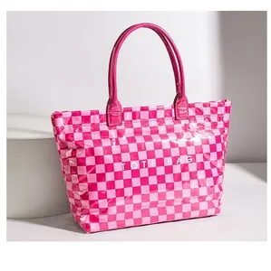 Stylish pink checkerboard PVC tote bag with large capacity for commuting and shopping