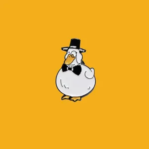 Enamel pin featuring a cute white duck wearing a black top hat and a black bow tie.
