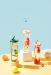Detail view of three colorful plastic straw water bottles with fruit infuser inserts.