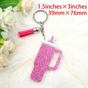 Detail view of pink glitter tumbler keychain charm with dimensions 1.5x3 inches