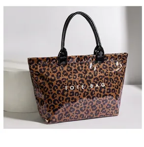 Large capacity glossy leopard print PVC tote bag with black handles and TOTE BAG text