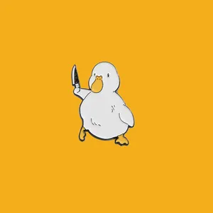 Detailed macro view of a cute white duck holding a knife enamel pin brooch jewelry