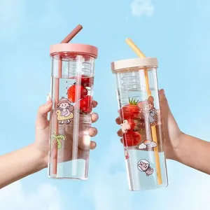 Two clear plastic tumblers with fruit infuser straws and cute cartoon prints for daily use