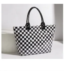 Retro black and white checkerboard tote bag made of high-quality glossy PVC material