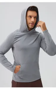 Premium men's slim fit athletic hoodie made of breathable grey fabric for gym training