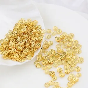 Detailed view of golden 18k gold plated hollow flower spacer beads for DIY jewelry